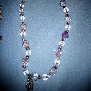 Beaded necklace with charm.